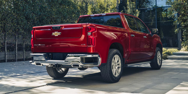 Red Chevy Silverado 1500 Standing still in sunny weather