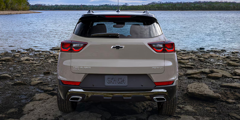 Cream white 2026 Chevrolet Trailblazer in it's back profile facing towards sea