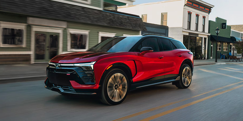 Red 2026 Chevrolet Blazer EV cruising on city roads
