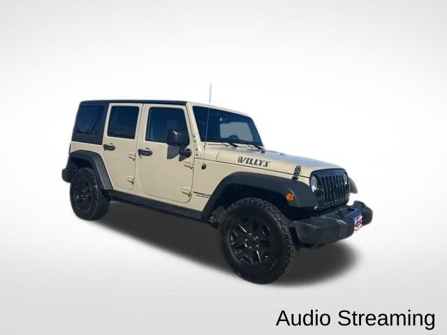 Used 2017 Jeep Wrangler Unlimited Willys Wheeler with VIN 1C4BJWDG1HL674751 for sale in Houghton Lake, MI